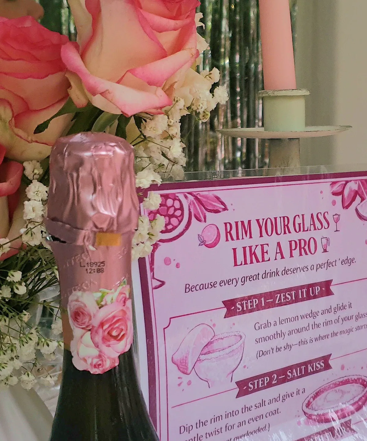 A card showing guests how to rim their glass, beside pink roses
